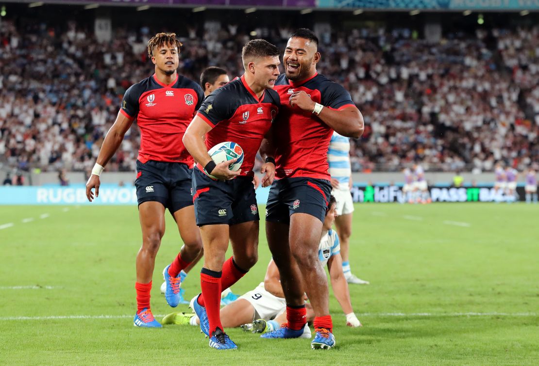Ben Youngs of England celebrates scoring his side's third try with his teammate Manu Tuilagi during the Rugby World Cup 2019 Group C game between England and Argentina at Tokyo Stadium.