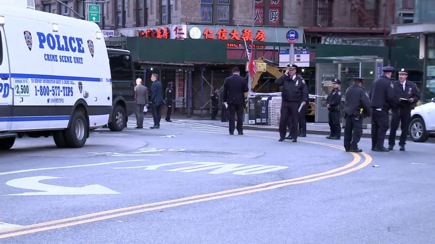Police gathered in Manhattan's Chinatown neighborhood on Saturday morning after attacks on five men in the borough who were believed to be homeless.