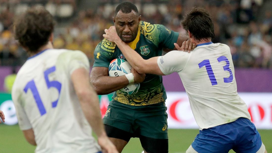 Australia's Tevita Kuridrani is tackled by Uruguay's Tomas Inciarte during the Rugby World Cup Pool D game at Oita Stadium.
