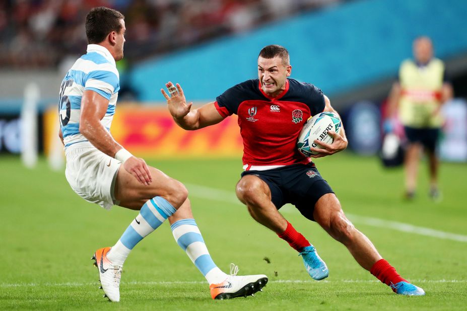 Jonny May of England takes on Emiliano Boffelli of Argentina. May scored the opening try for his side.