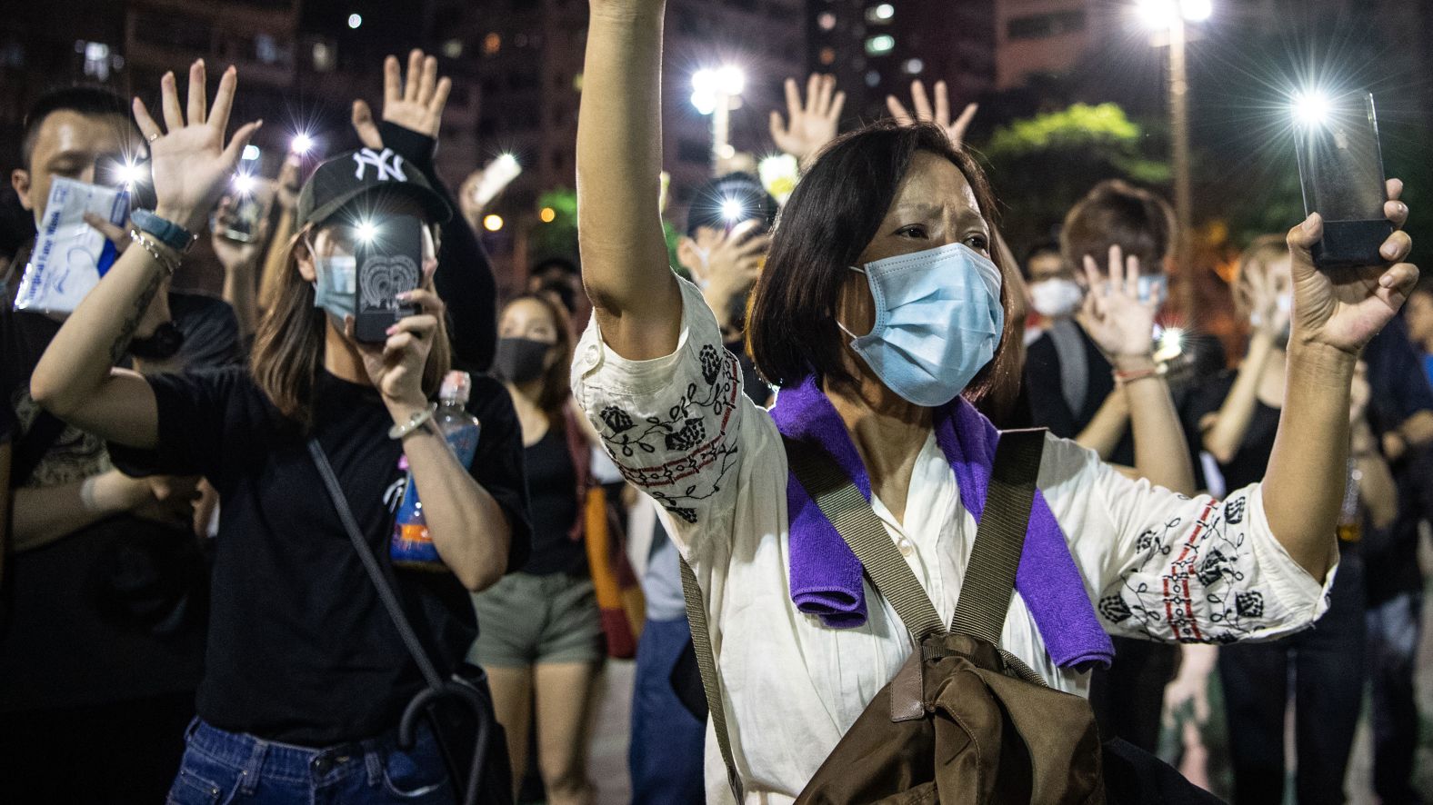 People protest the ban against masks on Saturday, October 5.