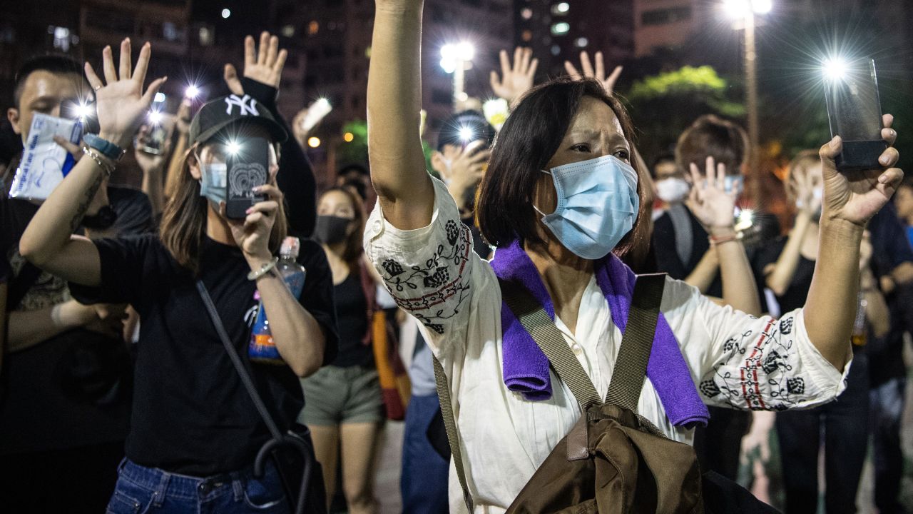 People protest the ban against masks on Saturday, October 5.