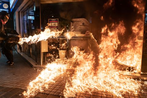 Protesters set a fire at a China Construction Bank.