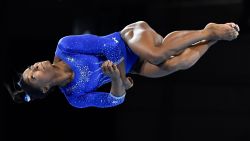 TOPSHOT - US gymnast Simone Biles turns in the air as she performs on the floor during a training session at the FIG Artistic Gymnastics World Championships in Stuttgart, southern Germany, on October 1, 2019. - The world championships will be running from October 4 until October 13, 2019. (Photo by THOMAS KIENZLE / AFP) (Photo by THOMAS KIENZLE/AFP via Getty Images)