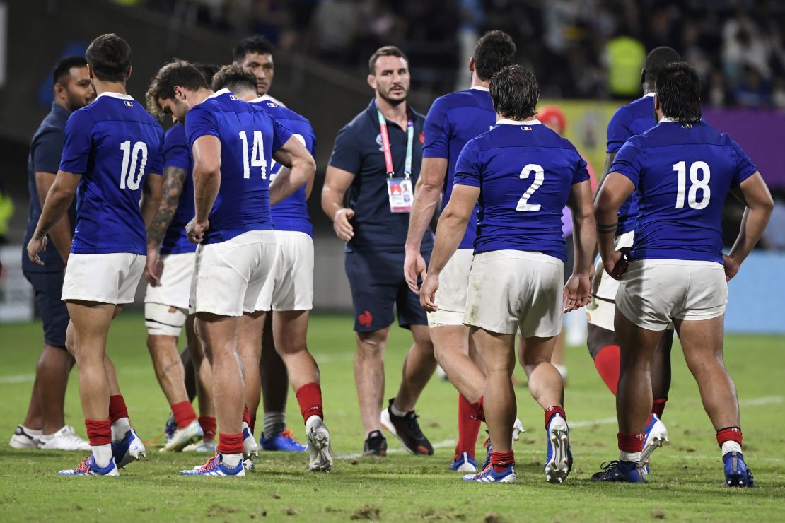 France's players trudge off after holding off the strong challenge of Tonga to win the Rugby World Cup Pool C in Kumamoto 23-21.