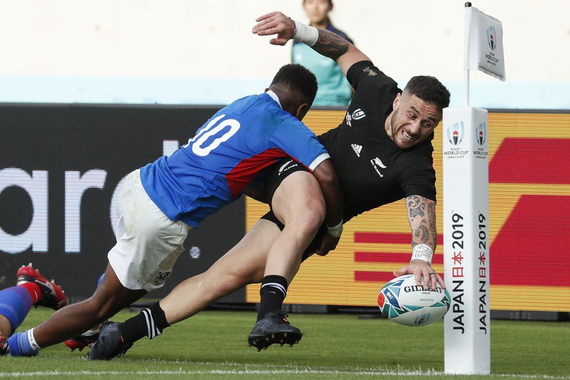 New Zealand's scrum-half TJ Perenara scores a spectacular final try in his side's 71-9 win over Namibia in their  Rugby World Cup Pool B match at the Tokyo Stadium.