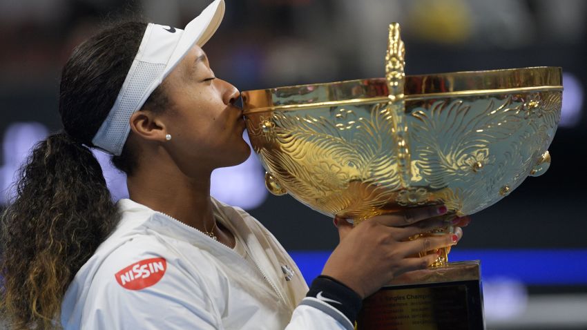 Naomi Osaka of Japan poses with the trophy after beating Australia's Ashleigh Barty in the final of the China Open in Beijing.