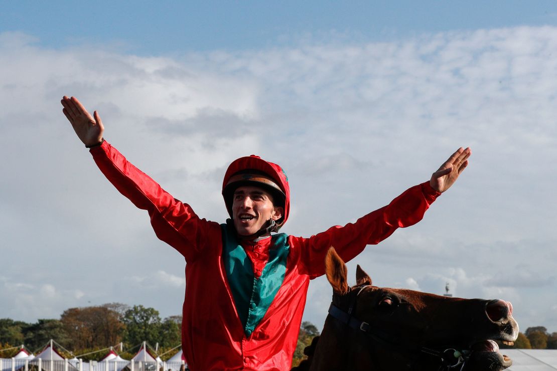 French jockey Pierre-Charles Boudot celebrates his victory on Waldgeist in the 2019 Qatar Prix de l'Arc de Triomphe.