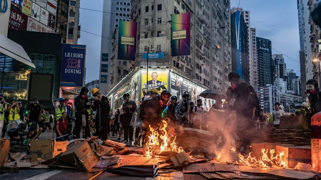 Pro-democracy protesters set fires in the street in the Causeway Bay area.