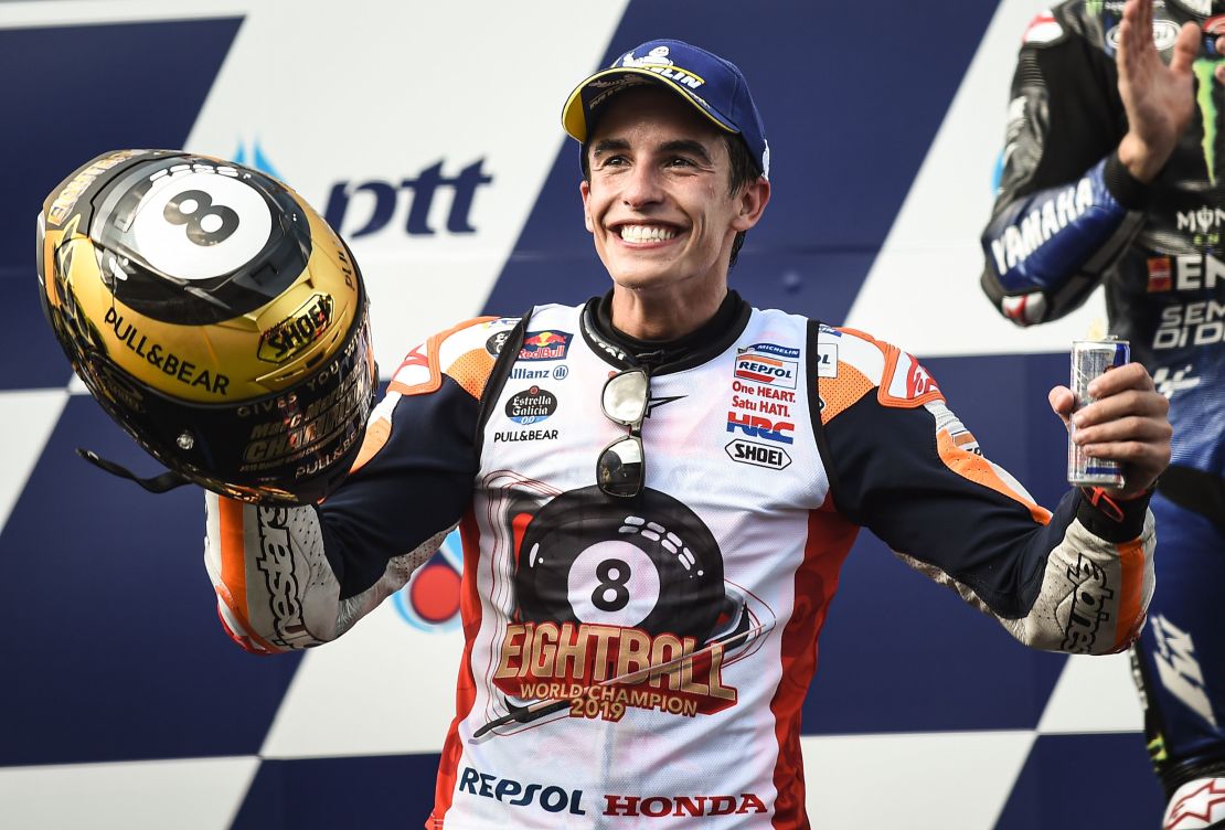Spain's Marc Marquez celebrates on the podium after winning the Thailand MotoGP to clinch his sixth world title in the premier class and eighth overall. 