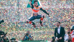 Marc Marquez jumps for joy as he celebrates his eighth world motorcycling title and sixth MotoGP crown.