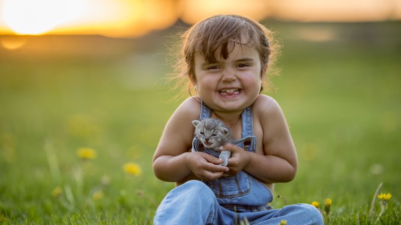 Pets bring joy to our lives (yes, dog lovers -- even cats). Need more proof than the gleeful smile on this child's face? <a href="index.php?page=&url=https%3A%2F%2Fwww.sciencedirect.com%2Fscience%2Farticle%2Fpii%2FS0747563215004343" target="_blank" target="_blank">A study from Indiana University</a> found simply watching cat videos boosted energy and healthy positive emotions and decreased negative feelings. 