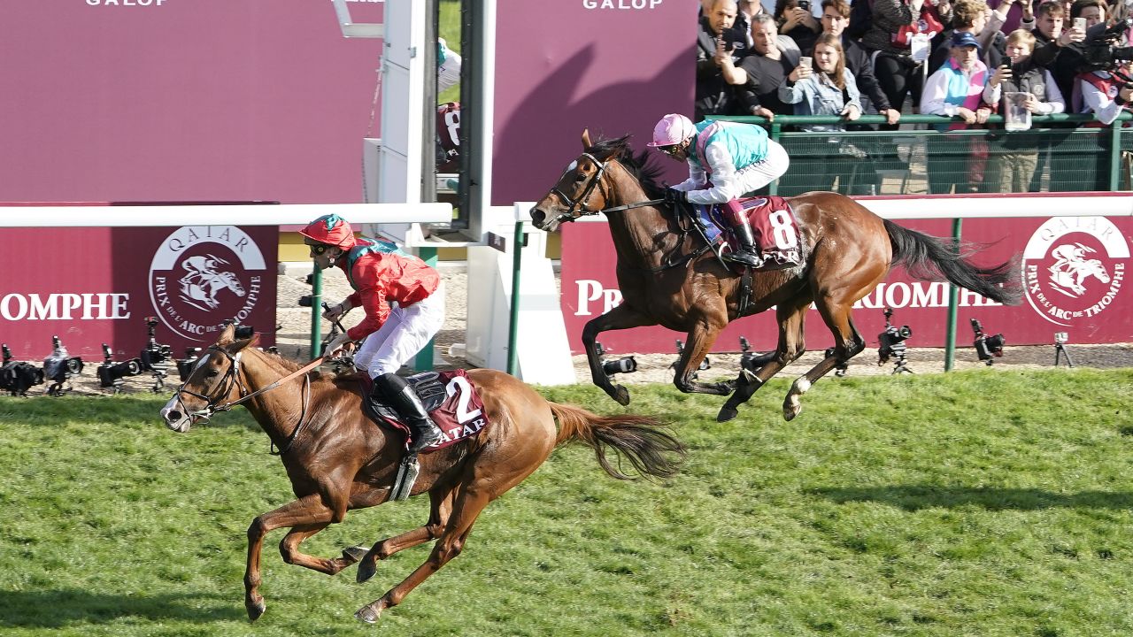 Waldgeist (left) dashes Enable's hopes of a record third straight Arc title.