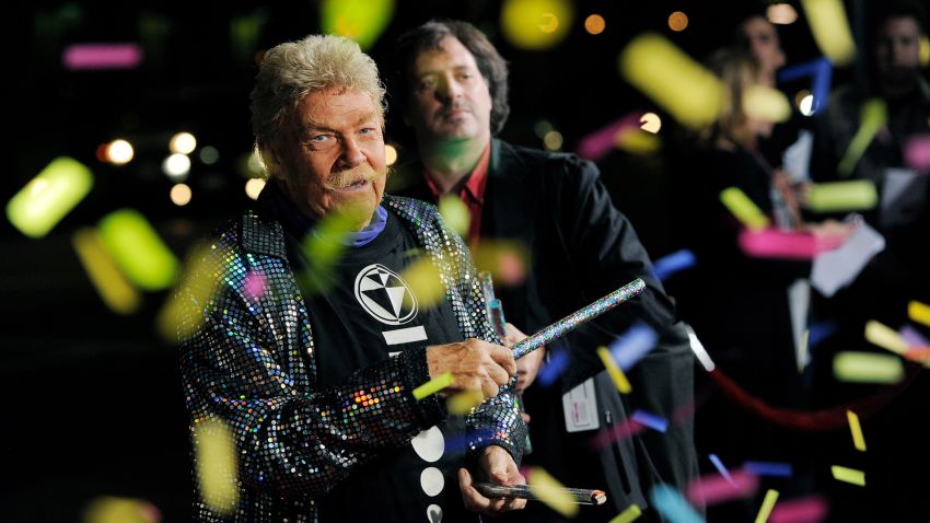 Comedian Rip Taylor throws confetti on photographers at the premiere of the film "Jackass 3D" in Los Angeles, Wednesday, Oct. 13, 2010, in Los Angeles. (AP Photo/Chris Pizzello)