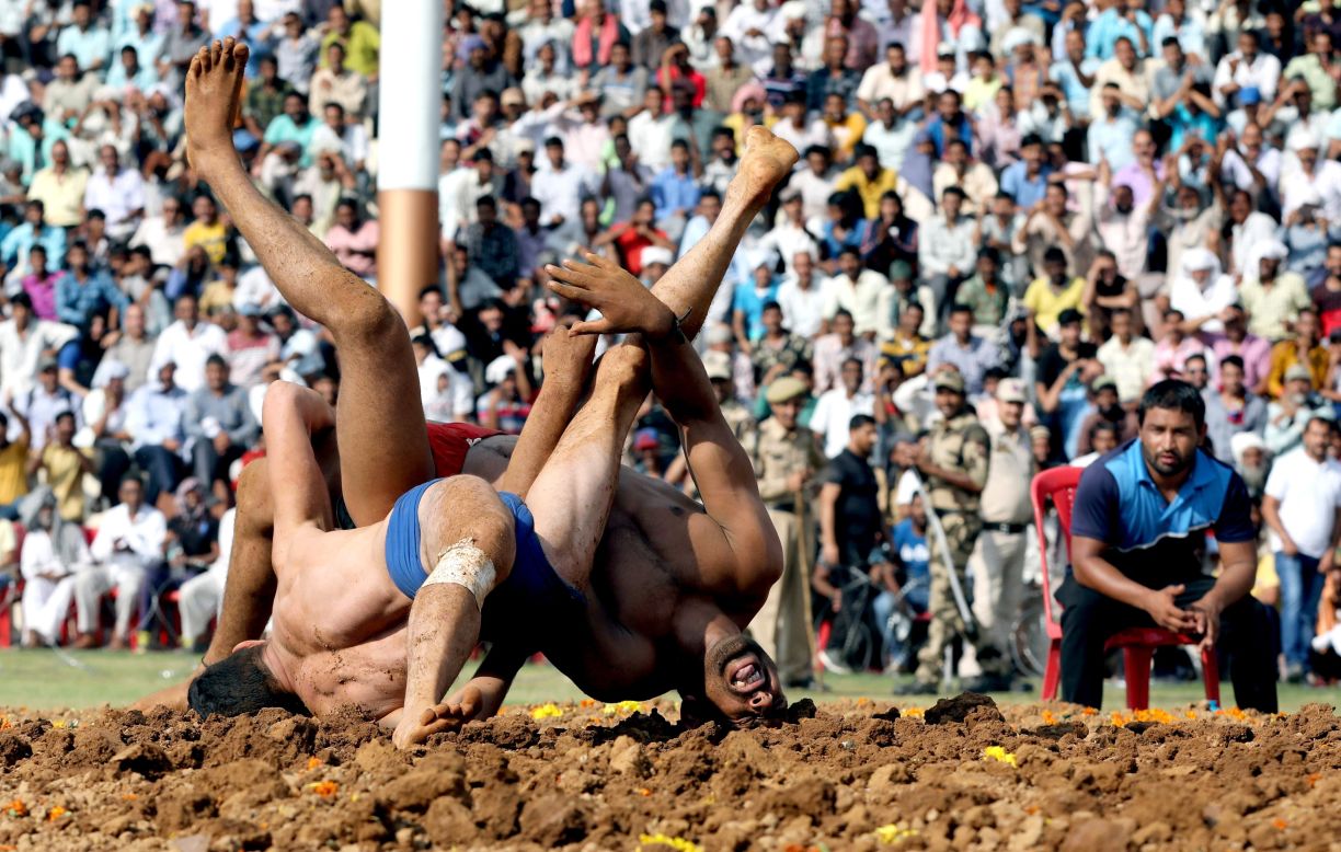 Reza, left, takes on Munner during an Indian-style wrestling competition in Katra, a town in Indian-controlled Kashmir, on Wednesday, October 2.