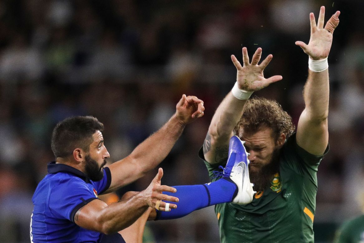 South Africa's RG Snyman, right, charges at Italy's Tito Tebaldi during a Rugby World Cup match on Friday, October 4.