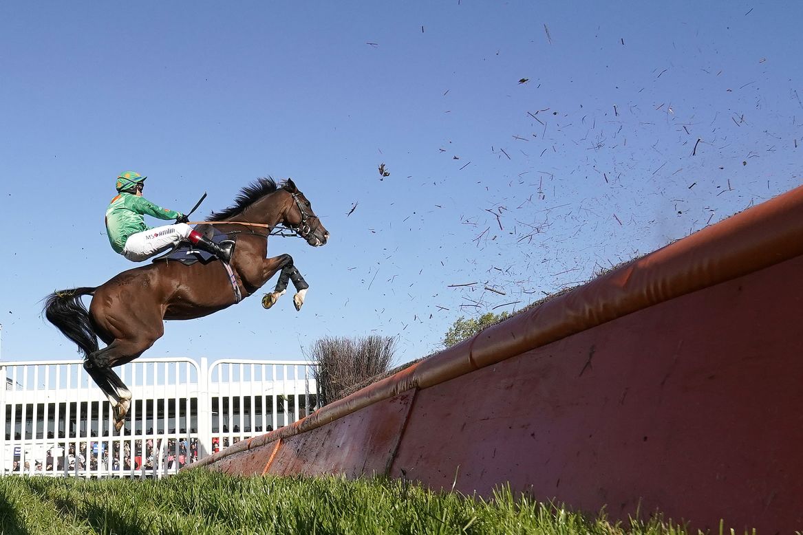 Invincible Don, with jockey RIchard Johnson, leaps over a fence during a race in Huntingdon, England, on Wednesday, October 2.