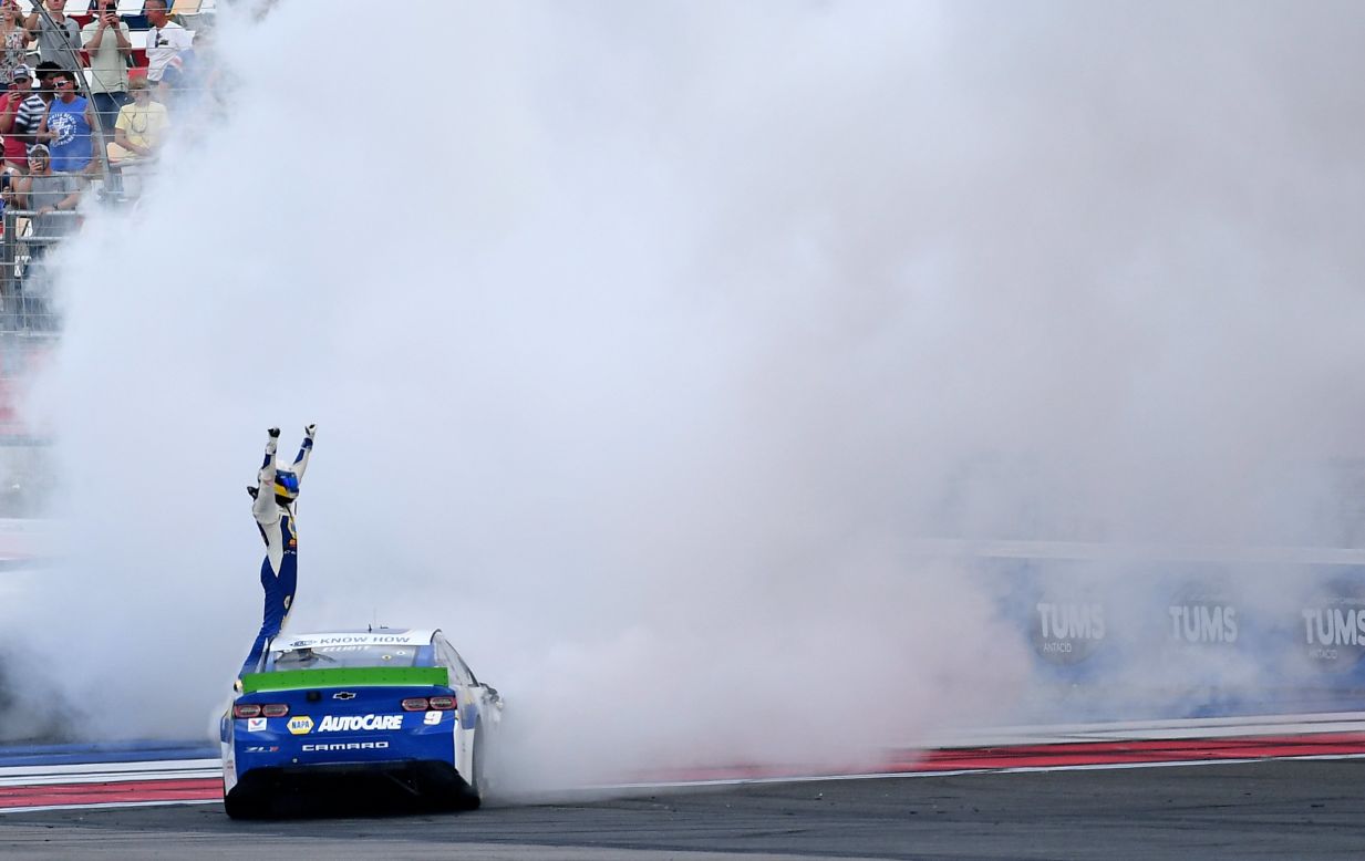 NASCAR driver Chase Elliott celebrates after winning a Cup Series race at Charlotte Motor Speedway on Sunday, September 29.