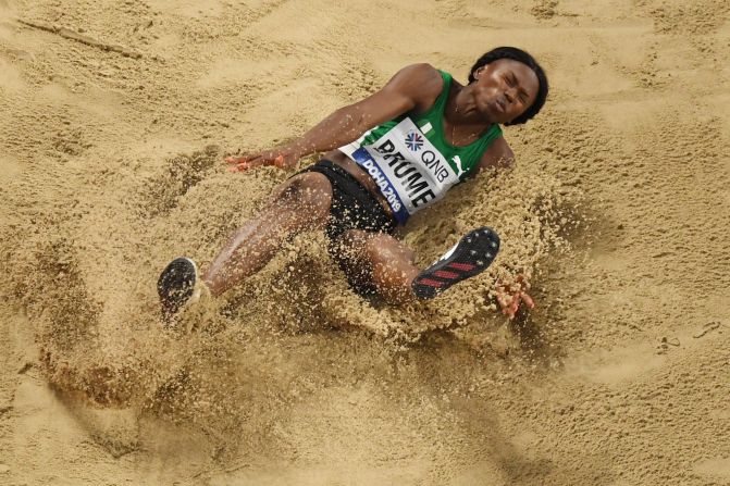 Nigerian long jumper Ese Brume lands in the sand pit while competing at the World Championships on Sunday, October 6. She finished with the bronze.