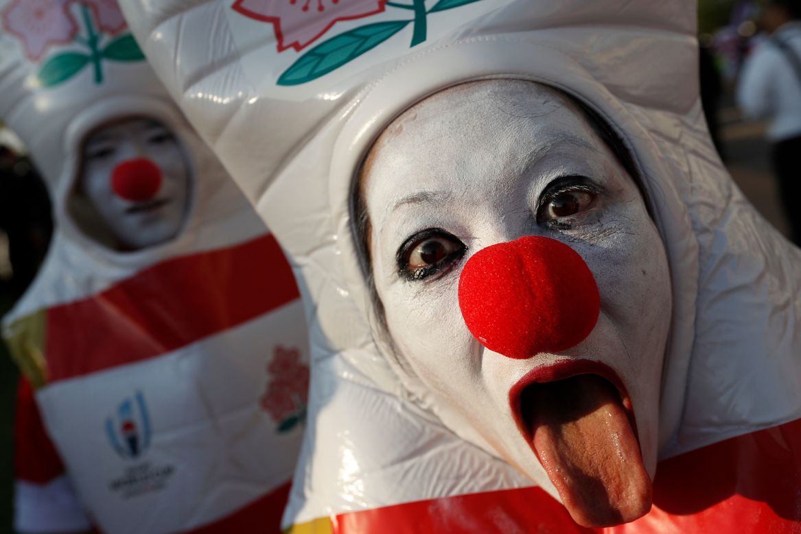 A Japan supporter poses for the camera before a Rugby World Cup match against Samoa on Saturday, October 5.