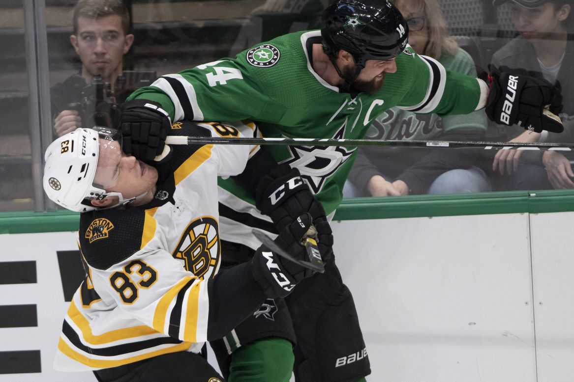 Boston's Karson Kuhlman is hit in the face by Dallas' Jamie Benn during an NHL game on Thursday, October 3.