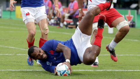 France's Alivereti Raka touches the ball down to score an early try against Tonga in his side's narrow 23-21 win in Pool C.