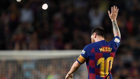 Lionel Messi soaks up the adulation of the crowd after a trademark free-kick.