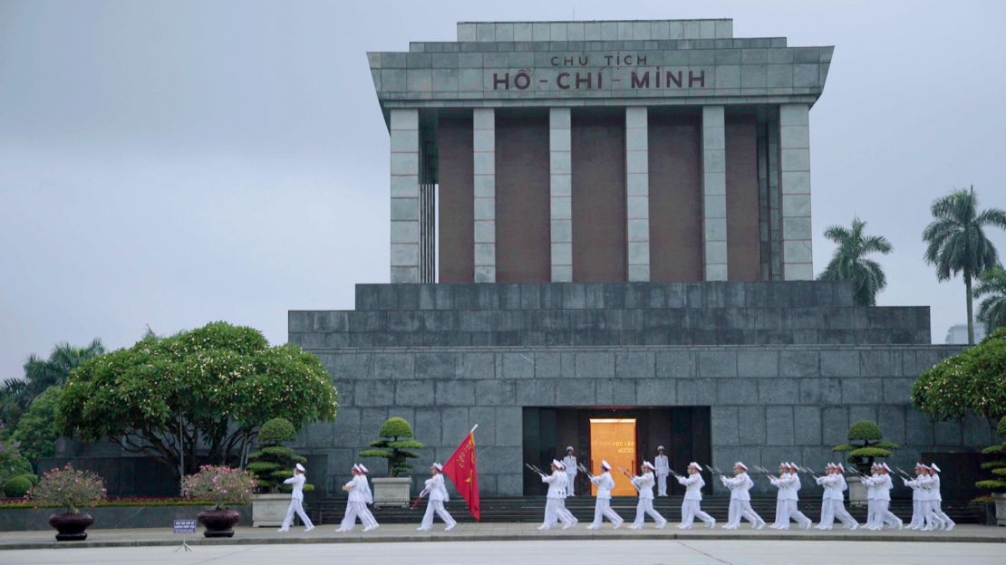 The flag ceremony takes place daily at 6 a.m. outside the Ho Chi Minh Mausoleum.