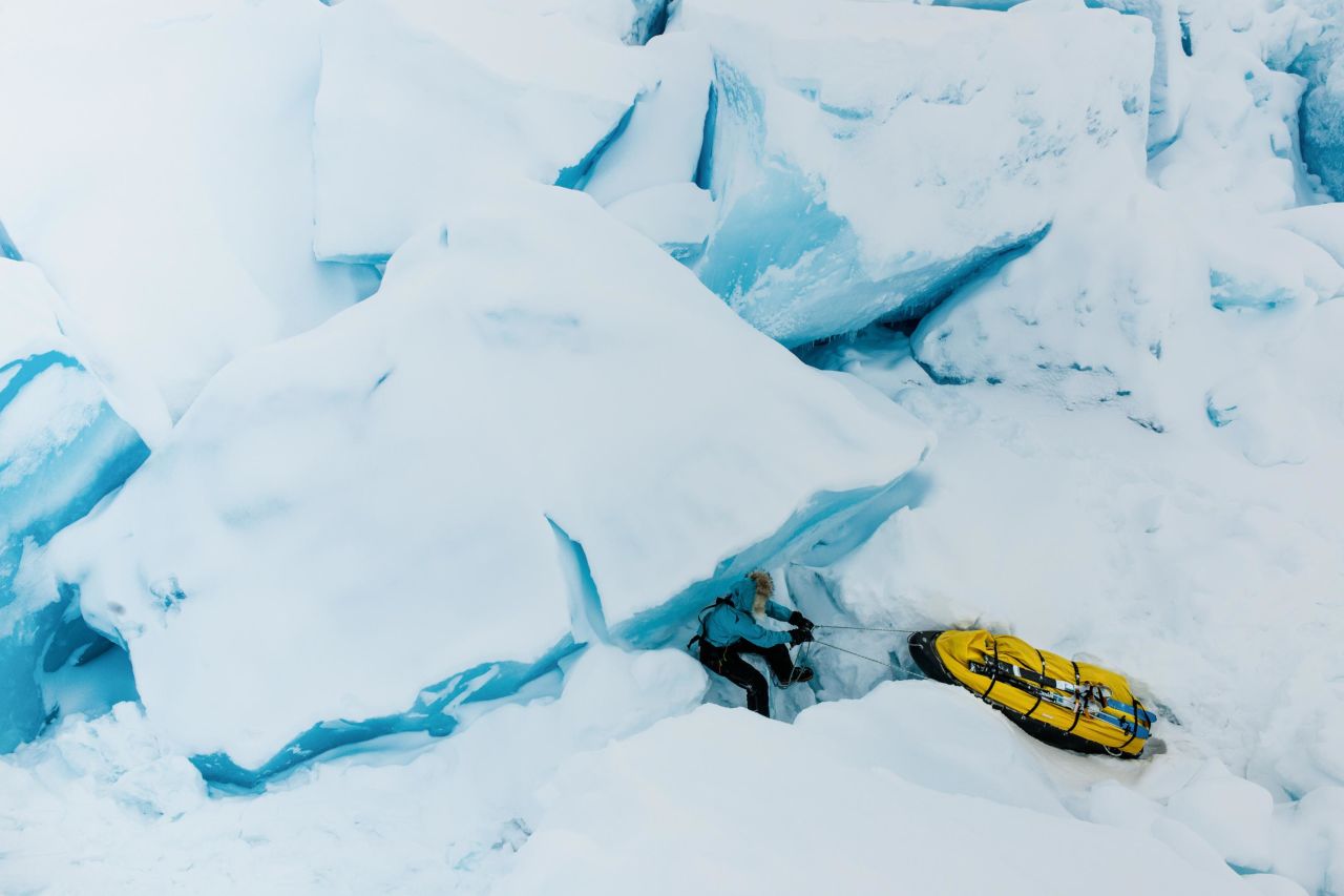 Sea ice in the Arctic Ocean is shrinking fast. But what does that look like? (Pictured: Climate journalist and adventurer Bernice Notenboom negotiating sea ice in the Arctic, photographed by Martin Hartley in 2014.) 
