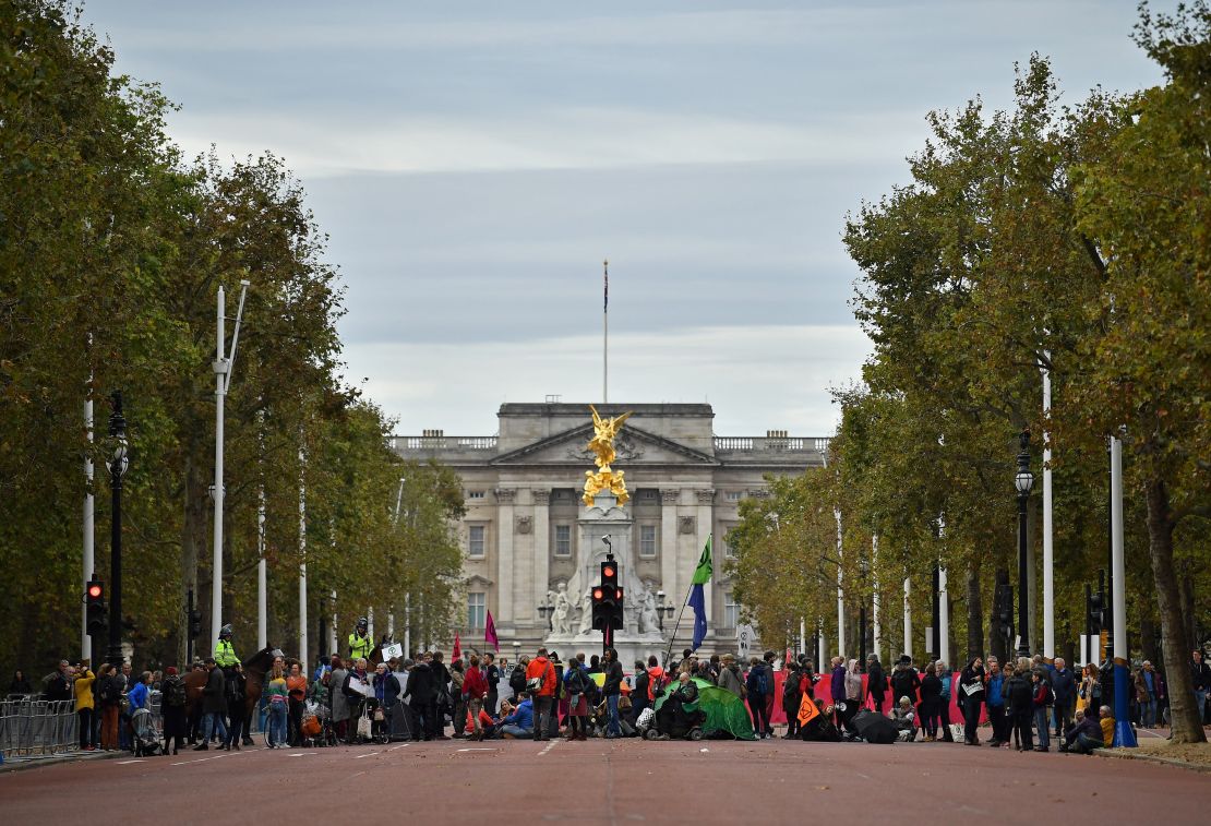 Climate change activists block The Mall as they demonstrate near Buckingham Palace.