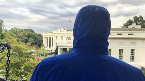 Caesar looks toward the White House after a meeting with administration officials in a nearby building.