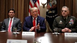 President Donald Trump speaks as Chairman of the Joint Chiefs of Staff Gen. Mark Milley and Defense Secretary Mark Esper, left, listen during a briefing with senior military leaders in the Cabinet Room at the White House in Washington, Monday, Oct. 7, 2019. (AP Photo/Carolyn Kaster)