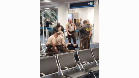 The passenger who forced his way onto an American Airlines flight was removed and taken to a hospital for evaluation.  
