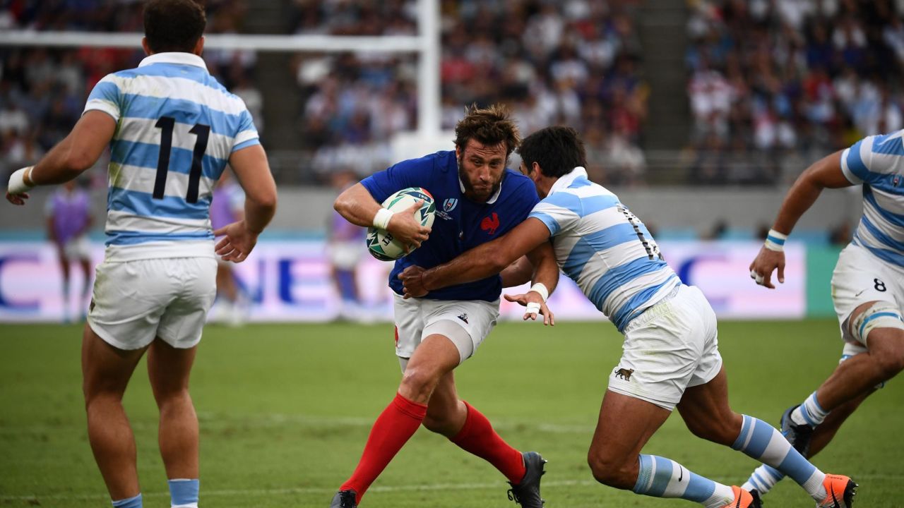 France's full back Maxime Medard (L) is tackled by Argentina's centre Matias Orlando (R) during the match between France and Argentina.