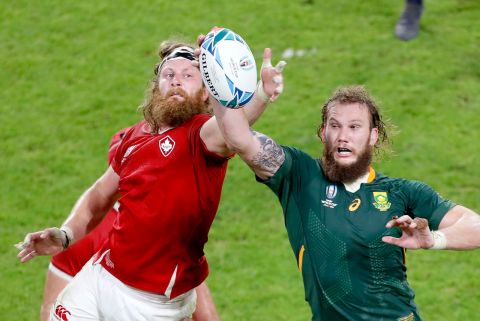 Canada's Evan Olmstead (left) and South Africa's RG Snyman compete for the ball.