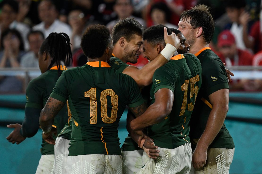 South Africa's full back Damian Willemse celebrates with teammates after scoring a try against Canada.