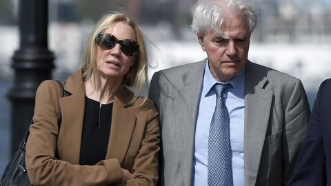Marcia and Gregory Abbott leave federal court after they pleaded guilty to conspiracy charges on May 22, 2019.