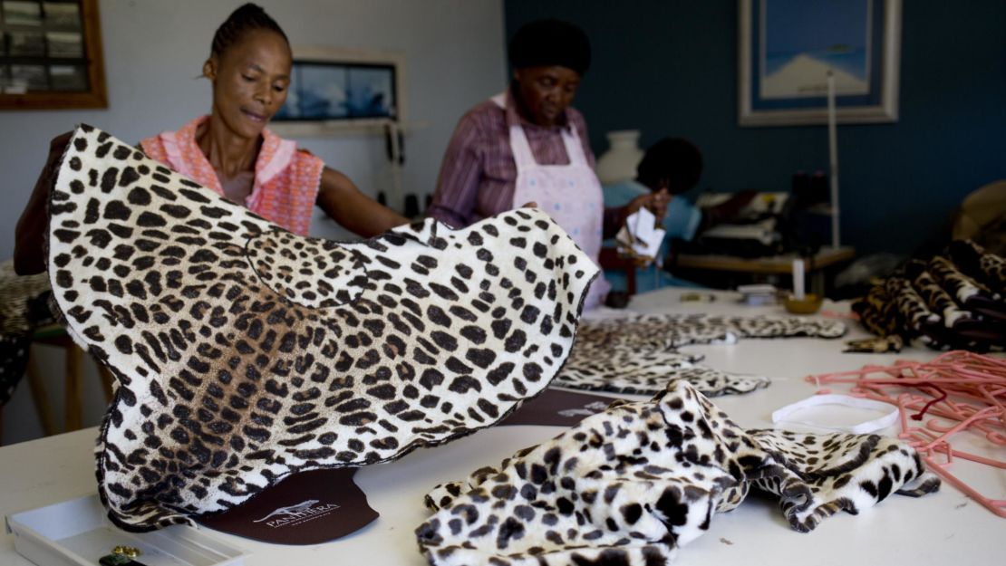 Tailors in Durban, South Africa, sew fake fur leopard capes for members of the Shembe Church.