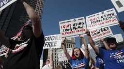Vaping advocates chant "I Vape, I Vote" during a rally on Tuesday, Oct. 1, 2019 at the Ohio Statehouse in Columbus, Ohio. The Ohio Vapor Trade Association and the Vapor Technology Association hosted the rally. (Joshua A. Bickel/The Columbus Dispatch via AP)