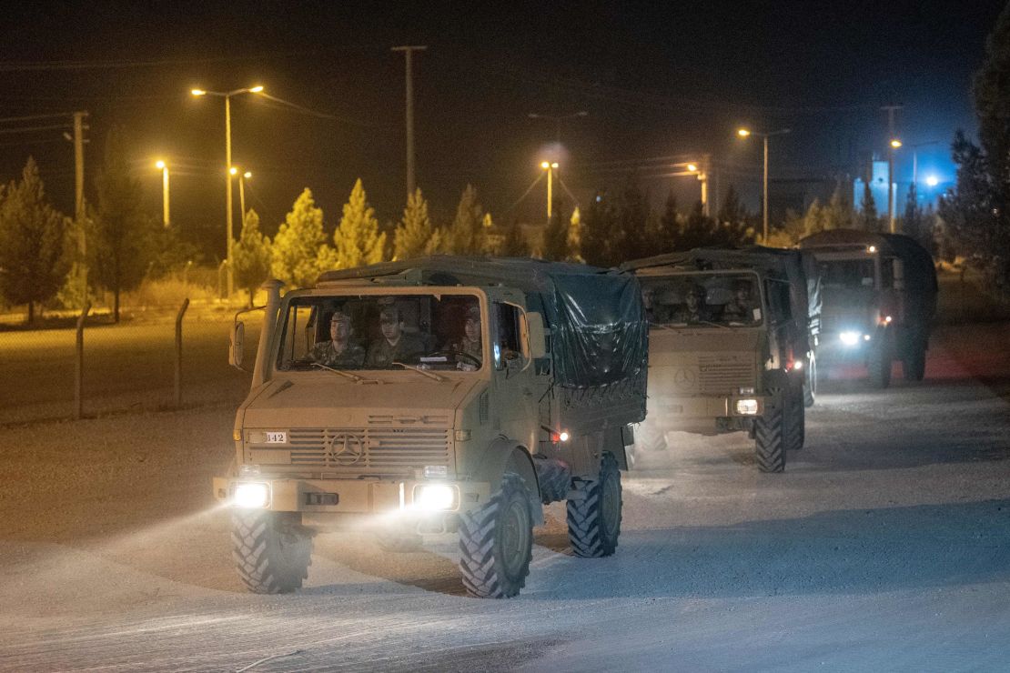 Turkish army soldiers drive towards the border with Syria near Akcakale in Sanliurfa province on October 8, 2019.