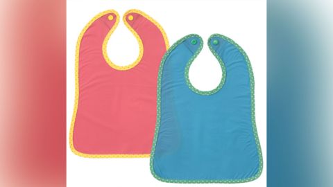 The recalled infant bibs appear as a pair in a pack, and were sold in stores worldwide