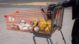 A customer pushes a shopping cart with batteries and flashlights in a Home Depot Inc. parking lot in Emeryville, California, U.S., on Tuesday, Oct. 8, 2019. Come Wednesday, utility PG&E Corp. plans to shut electricity to 800,000 California homes and businesses -- representing roughly 2.4 million people -- to prevent wildfires as high winds are forecast to whip through the state.