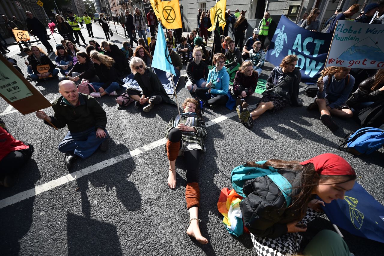Activists stage a sit-down protest outside Dublin's Government Buildings.