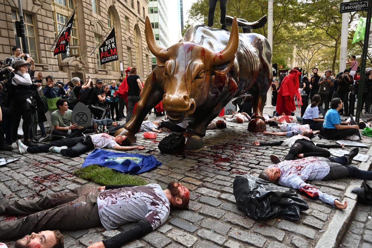 In New York, demonstrators congregate at Washington Square Park as they launched actions around the city on October 7. The protests included pouring fake blood over Wall Street's Charging Bull statue.