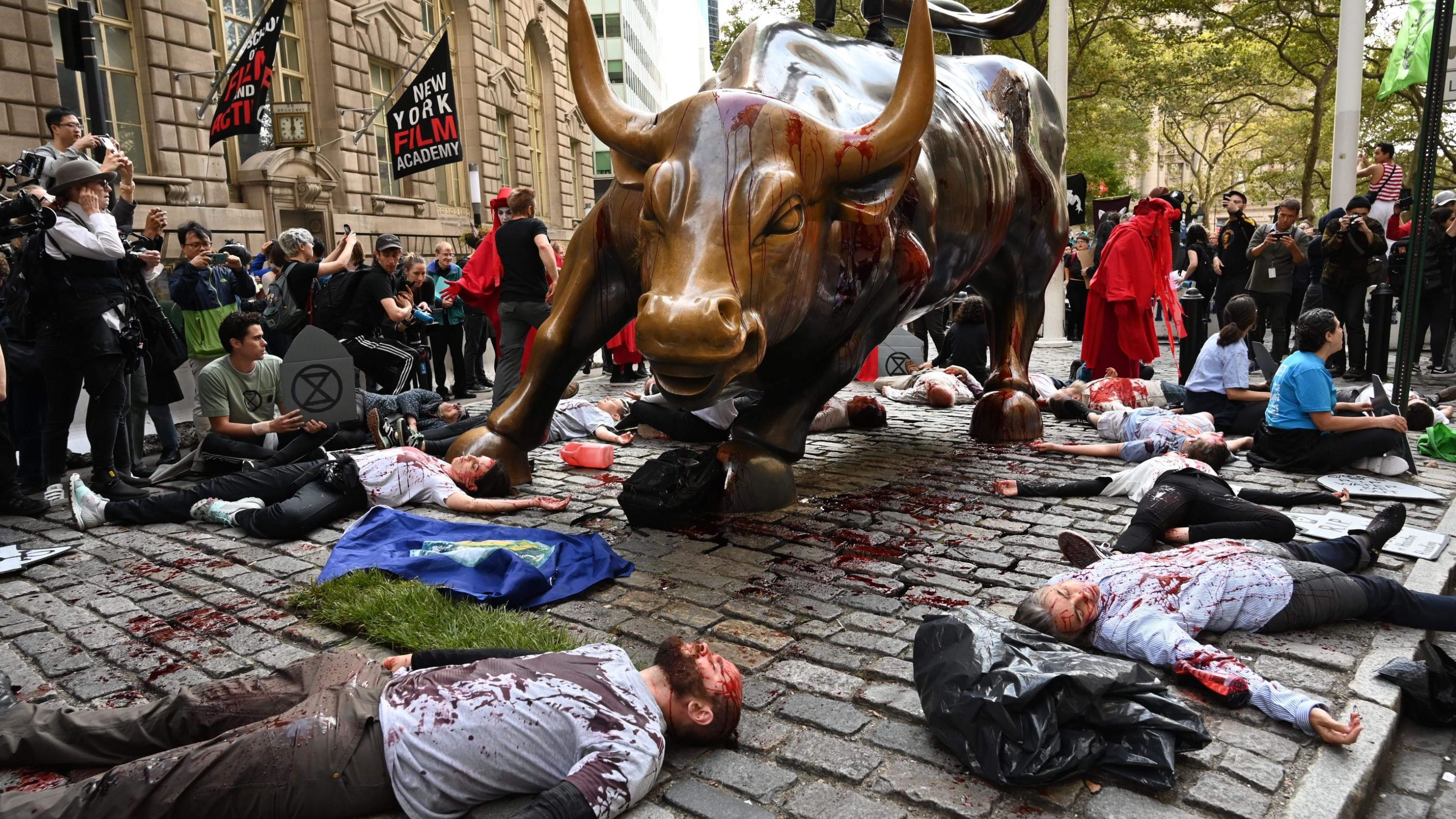 In New York, demonstrators congregate at Washington Square Park as they launched actions around the city on October 7. The protests included pouring fake blood over Wall Street's Charging Bull statue.