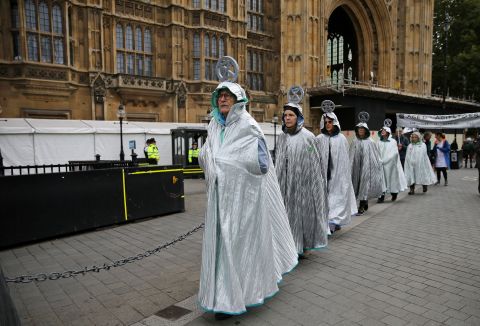 A group calling itself the Aged Agitators demonstrates outside London's Houses of Parliament.
