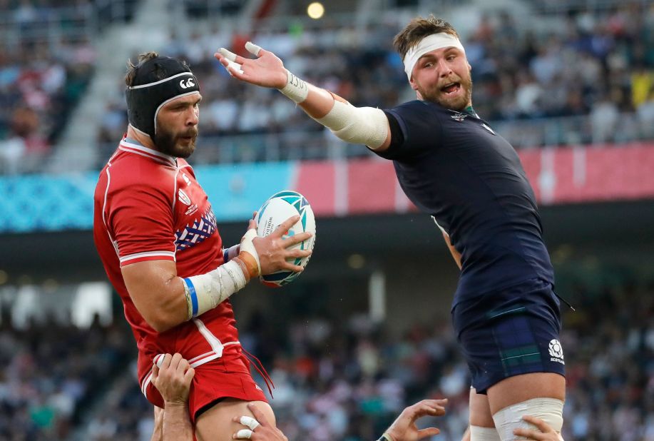 Russia struggled with its set-pieces all afternoon, but Ryan Wilson (right) couldn't quite intercept this one as Russia's Andrey Ostrikov (left) catches the ball.