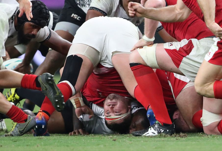 Wales fell behind by 10 points early in the first half, but a hat-trick from Josh Adams helped it recover. 