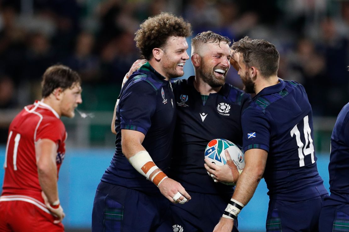 John Barclay celebrates after scoring a try against Russia.