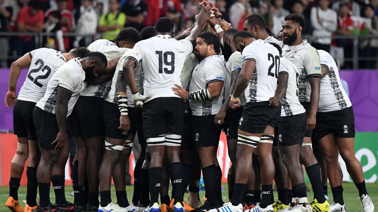 Fiji's players gather after its defeat to Wales.